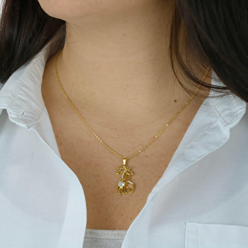 granddaughter wearing a 14k gold finished stainless steel giraffe neckalce